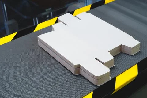 Line of assembly of cardboard packaging in boxes and finished products. tech  Stock Photos
