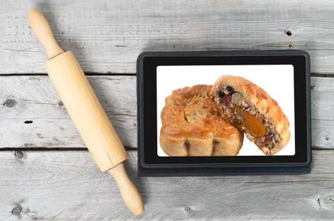 On-line bakery concept with a touch screen tablet and rolling pin Foto stock