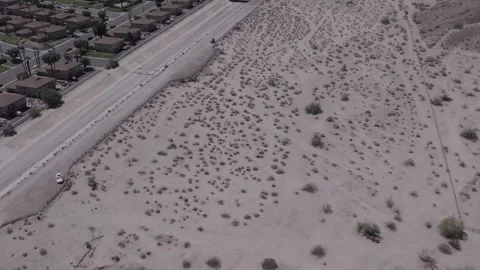 The line between desert landscape and busy city streets Stock Footage 245511516