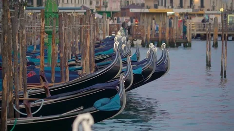 The line of black gondolas floating in the canal in Italy Stock Footage 85337126