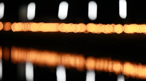 Line from bokeh and shadow Reflections on lagoon in night Stock Footage 44793804