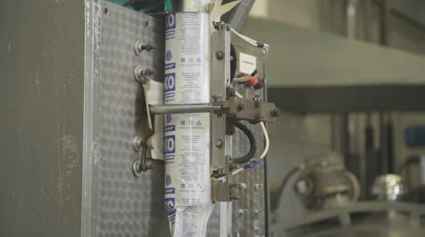 Line for bottling and packaging of milk in soft a polyethylene film Stock Footage 63872338