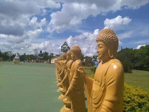 Line of Buddhas standing in Foz do Iguazu, Brazil Stock Photos