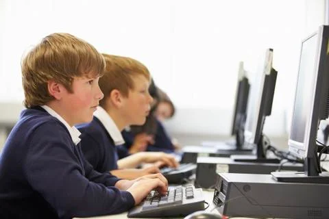 Line Of Children In School Computer Class Stock Photos