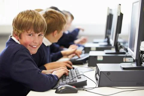 Line Of Children In School Computer Class Stock Photos