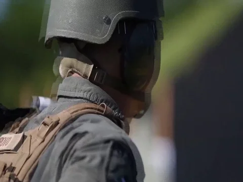Line coach teaching hand gestures and gun handling skills while shooting - 2017 Stock Footage 84692259
