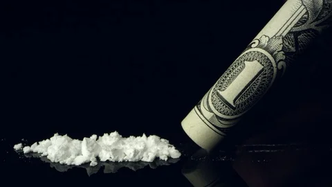 Line of cocaine being snorted up rolled up dollar bill Stock Footage 99779741