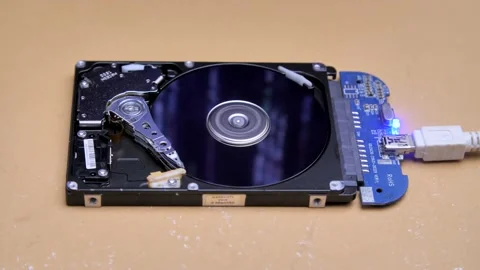 Line of code in the reflection on the HDD. Work of open hard drive inside. Video stock 132652136