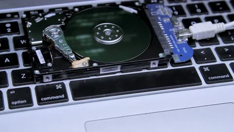 Line of code in the reflection on the HDD. Work of open hard drive inside. Video stock 132653887