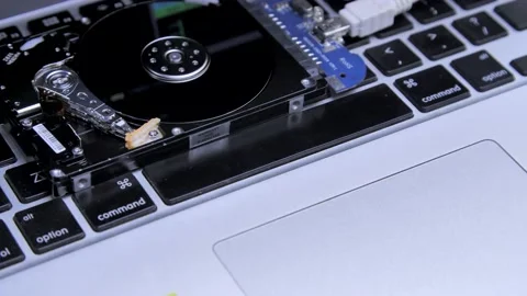 Line of code in the reflection on the HDD. Work of open hard drive inside. Video stock 132654188