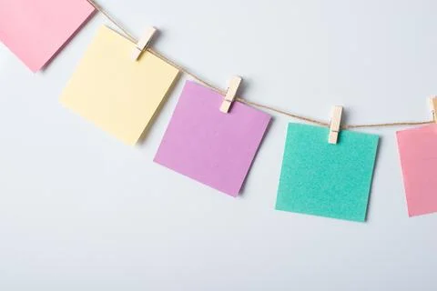 Line of colorful cards on a string Stock Photos