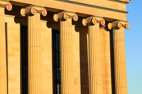 Line of Columns Bathed in Warm Sunlight Stock Photos