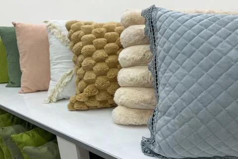 Line of decorative throw pillows Stock Photos
