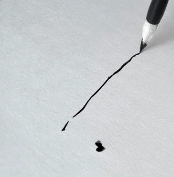 The line is drawn using black ink and a brush for calligraphy Stock Photos