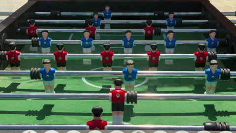 Line Of Figurines On Rods. Arcade Environment Featuring Tabletop Foosball And Stock Footage 337940016