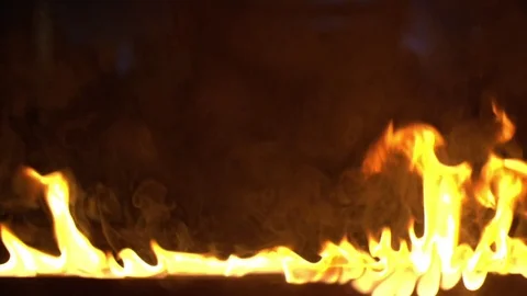 A line of fire burning in the dark place Stock Footage 76437157