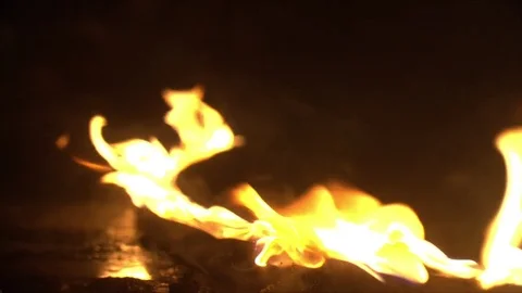 A line of fire burning in the dark place Stock Footage 76437174