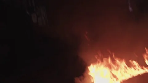 A line of fire burning in the dark place in slow motion Stock Footage 77069210