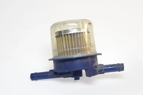 In-line fuel filter with plastic transparent separator bowl. on white backg.. Stock Photos