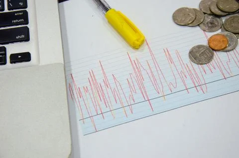 Line graph and coins Foto stock