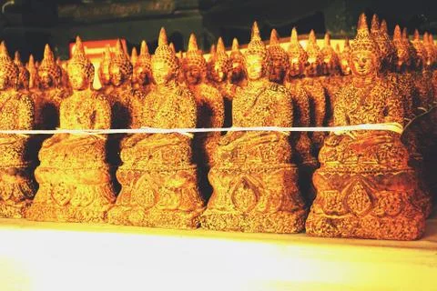 Line up of image of Buddha statues Stock Photos