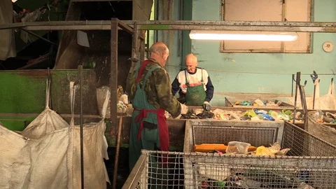 Line industrial sorting of different types of plastics waste people recycling Stock Footage 88994319