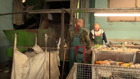 Line industrial sorting of different types of plastics waste people recycling Stock Footage 88997842