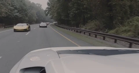 Line of Lamborghinis on highway Stock Footage 105122378
