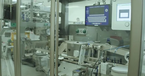 Line machine conveyer for packaging pills in boxes at pharmacy factory Stock Footage 101098333