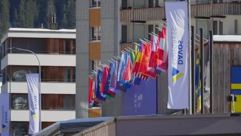 A line of national flags along the Davos promenade during the World Economic Stock Footage 345299468