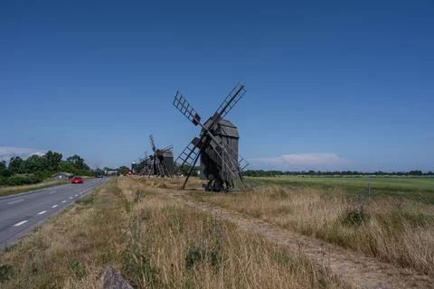 A line of old windmills on a plain Stock Photos