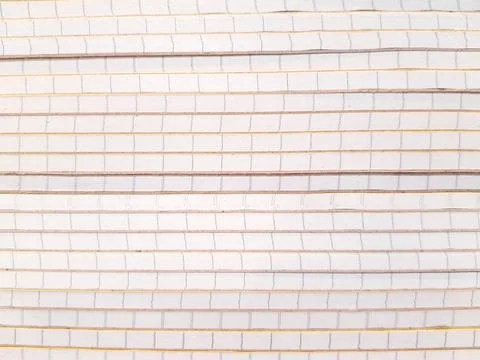 Line pattern of many saddle white book stack on the bookshelf at stationery. Stock Photos