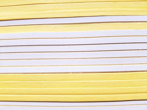 Line pattern of saddle yellow and white books stack on the bookshelf Stock Photos