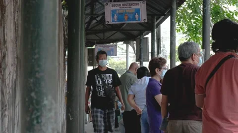 A line of people outside a make shift vaccination center Stock Footage 154747723