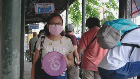 A line of people outside a make shift vaccination center Stock Footage 154747757