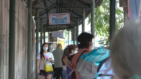A line of people outside a make shift vaccination center Stock Footage 154747780