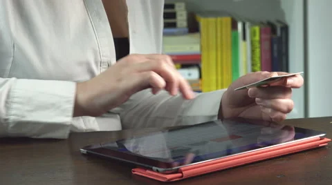 On line shopping using tablet and credit card at home Stock Footage 60575861