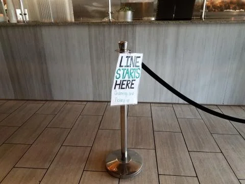 Line starts here ordering and pickup sign in restaurant Stock Photos