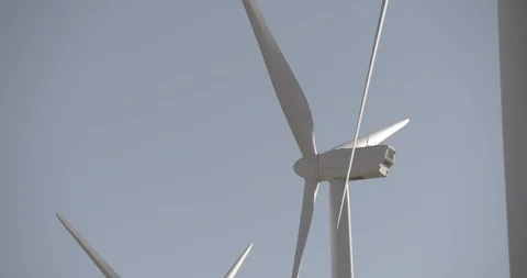 Line of Static Wind Mills Medium Shot - Pan Left Stock Footage 89942355