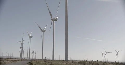 Line of Static Wind Mills Wide Shot - Pan Left Stock Footage 89942341