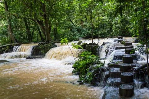 Line of stepping stone and waterfall in jungle Phuket, Thailand Stock Photos