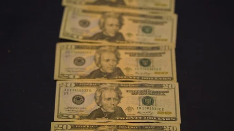 Line of Twenty Dollar Bills on a Table Stock Footage 94159451