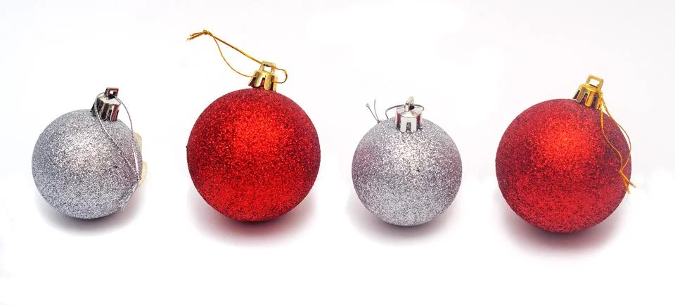 Line from two red and two silver Christmas balls isolated on white background Stock Photos