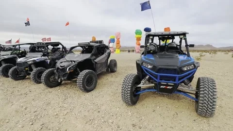 A line of UTV's parked at Seven Magic Mountains outside of Las Vegas Video stock 237838557