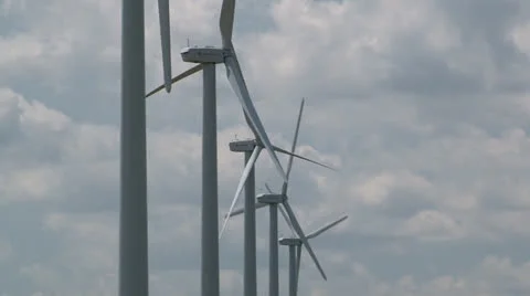 Line of wind turbines catch light breeze Stock Footage 25169690