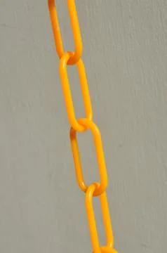 Line of yellow plastic chains Stock Photos