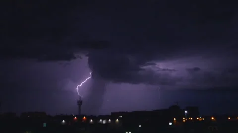 Linear lightning discharges into a pole in the ground Stock Footage 51814783