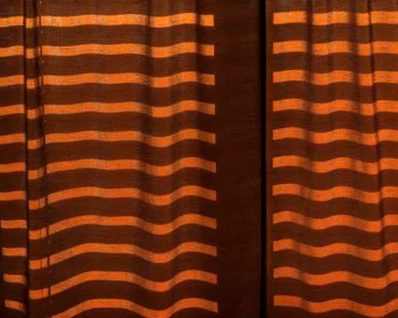 Linear shadows projected onto curtains Stock Photos