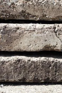 Linear texture of gray concrete plates with a crack stacked on top of each ot Stock Photos