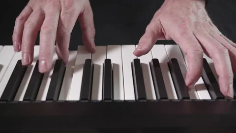 Linear tracking shot of playing the piano Stock Footage 134045353